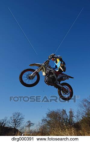 Motocross biker on dirt track View Large Photo Image Stock Image - Motocross biker on dirt track. Fotosearch