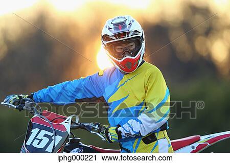 Motocross biker on dirt track View Large Photo Image Stock Image - Motocross biker on dirt track. Fotosearch