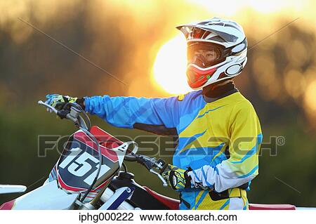 Motocross biker on dirt track View Large Photo Image Stock Image - Motocross biker on dirt track. Fotosearch