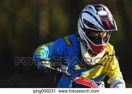 Motocross biker on dirt track View Large Photo Image Stock Image - Motocross biker on dirt track. Fotosearch