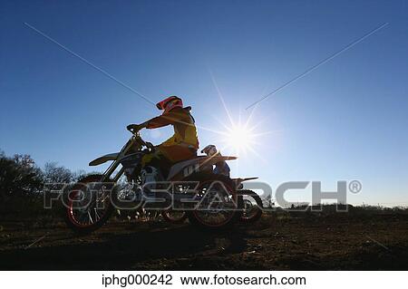 Motocross biker on dirt track View Large Photo Image Stock Image - Motocross biker on dirt track. Fotosearch