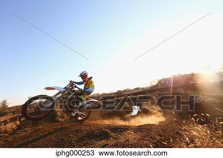 Motocross biker on dirt track View Large Photo Image Stock Image - Motocross biker on dirt track. Fotosearch