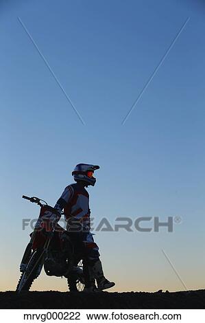 Motocross biker on dirt track View Large Photo Image Stock Image - Motocross biker on dirt track. Fotosearch