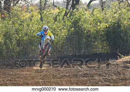 Motocross biker on dirt track View Large Photo Image Stock Image - Motocross biker on dirt track. Fotosearch