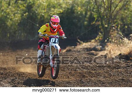 Motocross biker on dirt track View Large Photo Image Stock Image - Motocross biker on dirt track. Fotosearch