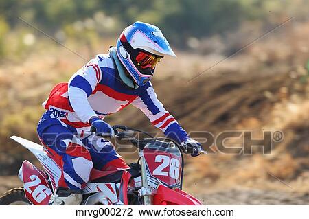 Motocross biker on dirt track View Large Photo Image Stock Image - Motocross biker on dirt track. Fotosearch