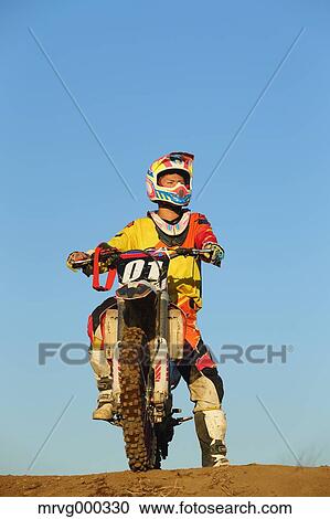 Motocross biker on dirt track View Large Photo Image Stock Image - Motocross biker on dirt track. Fotosearch