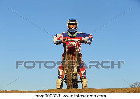 Motocross biker on dirt track View Large Photo Image Stock Image - Motocross biker on dirt track. Fotosearch