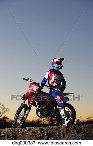 Motocross biker on dirt track View Large Photo Image Stock Photo - Motocross biker on dirt track. Fotosearch