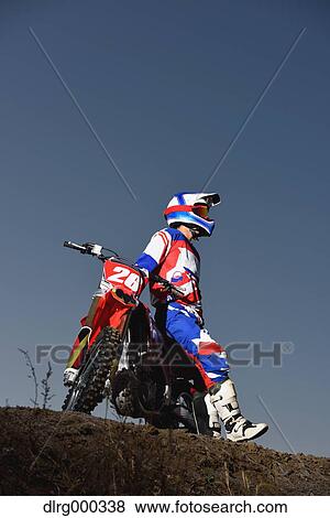 Motocross biker on dirt track View Large Photo Image Stock Photo - Motocross biker on dirt track. Fotosearch