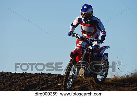 Motocross biker on dirt track View Large Photo Image Stock Photo - Motocross biker on dirt track. Fotosearch