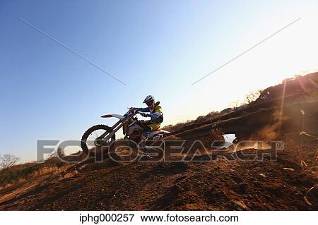 Motocross biker on dirt track View Large Photo Image Stock Photo - Motocross biker on dirt track. Fotosearch