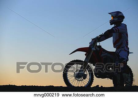 Motocross biker on dirt track View Large Photo Image Stock Photo - Motocross biker on dirt track. Fotosearch