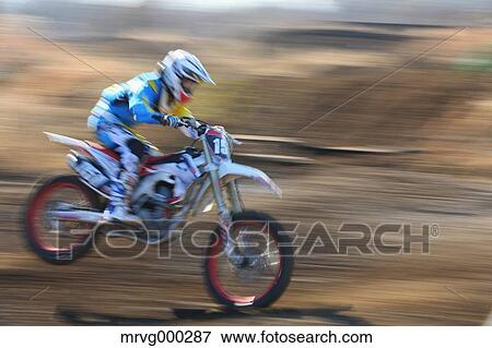 Motocross biker on dirt track View Large Photo Image Stock Photo - Motocross biker on dirt track. Fotosearch