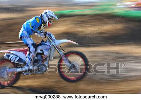 Motocross biker on dirt track View Large Photo Image Stock Photo - Motocross biker on dirt track. Fotosearch
