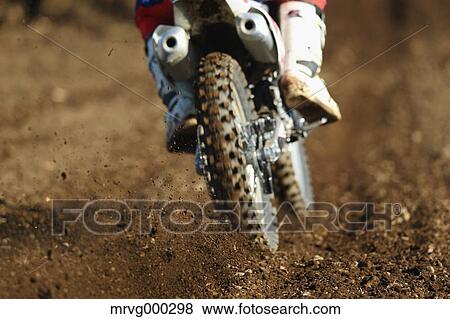 Motocross biker on dirt track View Large Photo Image Stock Photo - Motocross biker on dirt track. Fotosearch