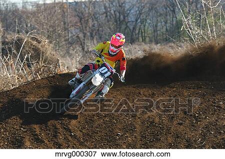Motocross biker on dirt track View Large Photo Image Stock Photo - Motocross biker on dirt track. Fotosearch