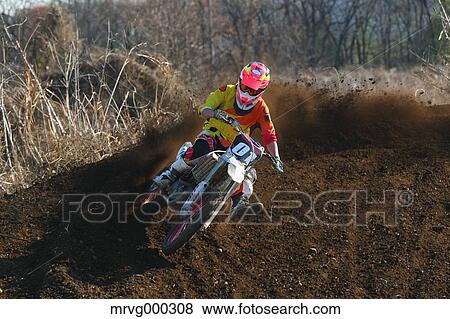 Motocross biker on dirt track View Large Photo Image Stock Photo - Motocross biker on dirt track. Fotosearch
