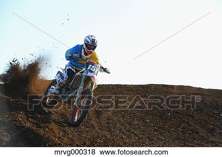Motocross biker on dirt track View Large Photo Image Stock Photo - Motocross biker on dirt track. Fotosearch