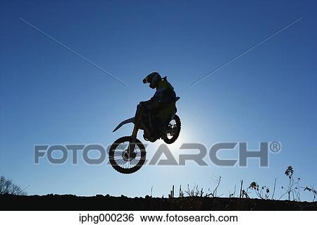 Motocross biker on dirt track View Large Photo Image Stock Photograph - Motocross biker on dirt track. Fotosearch