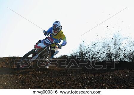 Motocross biker on dirt track View Large Photo Image Stock Photograph - Motocross biker on dirt track. Fotosearch