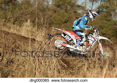Motocross biker on dirt track View Large Photo Image Stock Photography - Motocross biker on dirt track. Fotosearch
