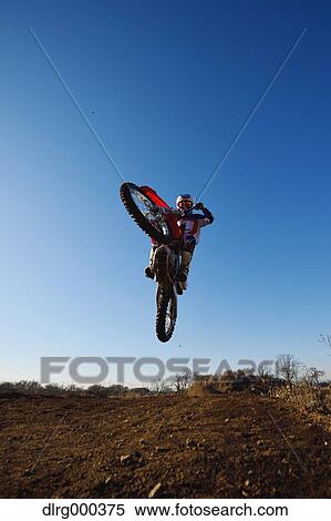 Motocross biker on dirt track View Large Photo Image Stock Photography - Motocross biker on dirt track. Fotosearch