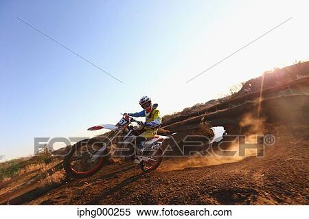 Motocross biker on dirt track View Large Photo Image Stock Photography - Motocross biker on dirt track. Fotosearch