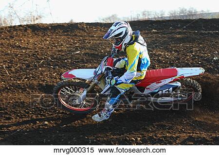 Motocross biker on dirt track View Large Photo Image Stock Photography - Motocross biker on dirt track. Fotosearch
