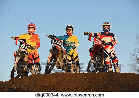 Motocross bikers on dirt track View Large Photo Image Picture - Motocross bikers on dirt track. Fotosearch