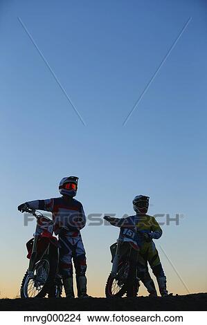 Picture - Motocross bikers on dirt track. Fotosearch
