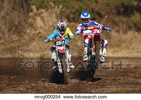 Motocross bikers on dirt track View Large Photo Image Picture - Motocross bikers on dirt track. Fotosearch