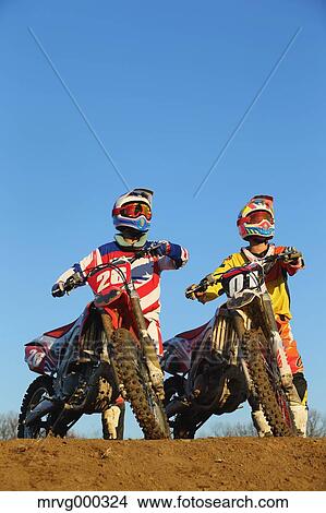 Picture - Motocross bikers on dirt track. Fotosearch