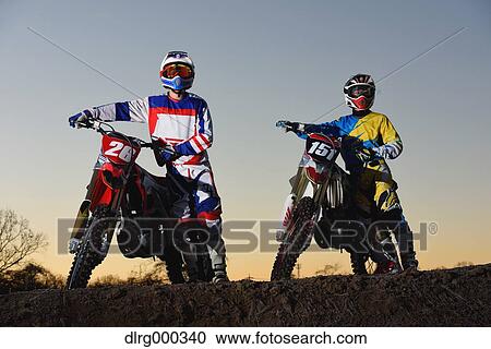 Motocross bikers on dirt track View Large Photo Image Stock Image - Motocross bikers on dirt track. Fotosearch