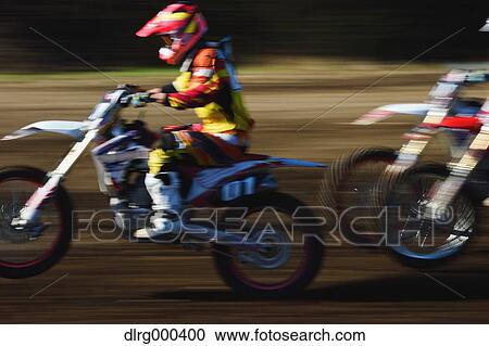 Motocross bikers on dirt track View Large Photo Image Stock Image - Motocross bikers on dirt track. Fotosearch