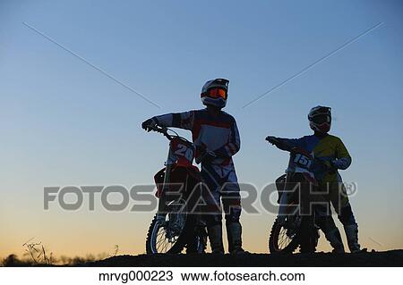 Motocross bikers on dirt track View Large Photo Image Stock Image - Motocross bikers on dirt track. Fotosearch