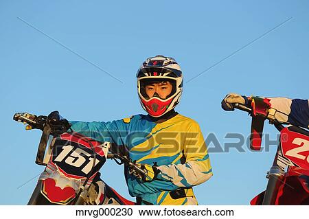 Motocross bikers on dirt track View Large Photo Image Stock Image - Motocross bikers on dirt track. Fotosearch