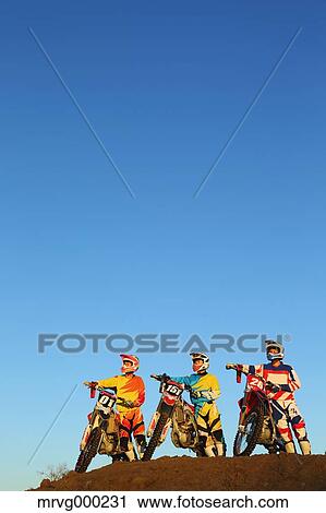 Motocross bikers on dirt track View Large Photo Image Stock Image - Motocross bikers on dirt track. Fotosearch
