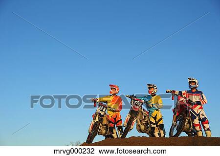 Motocross bikers on dirt track View Large Photo Image Stock Image - Motocross bikers on dirt track. Fotosearch