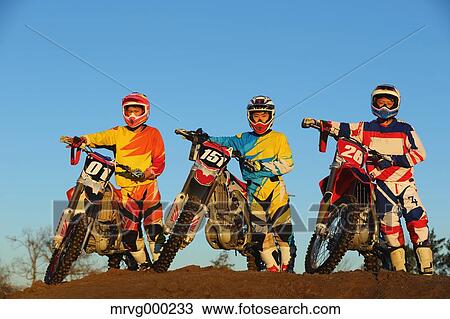Motocross bikers on dirt track View Large Photo Image Stock Image - Motocross bikers on dirt track. Fotosearch