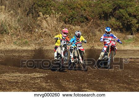 Motocross bikers on dirt track View Large Photo Image Stock Image - Motocross bikers on dirt track. Fotosearch