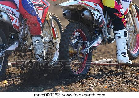 Motocross bikers on dirt track View Large Photo Image Stock Image - Motocross bikers on dirt track. Fotosearch