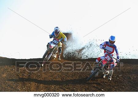 Motocross bikers on dirt track View Large Photo Image Stock Image - Motocross bikers on dirt track. Fotosearch