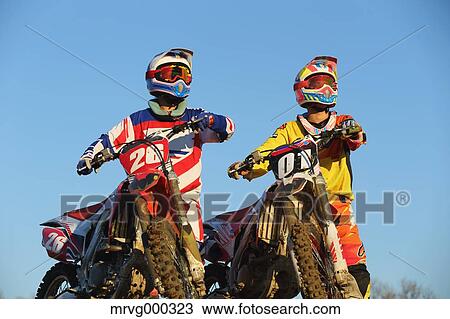 Motocross bikers on dirt track View Large Photo Image Stock Image - Motocross bikers on dirt track. Fotosearch