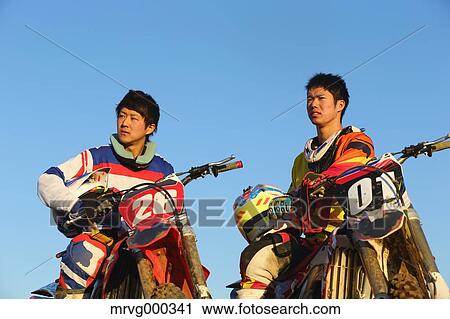 Motocross bikers on dirt track View Large Photo Image Stock Image - Motocross bikers on dirt track. Fotosearch