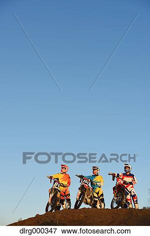 Motocross bikers on dirt track View Large Photo Image Stock Photo - Motocross bikers on dirt track. Fotosearch