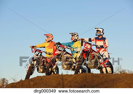 Motocross bikers on dirt track View Large Photo Image Stock Photo - Motocross bikers on dirt track. Fotosearch