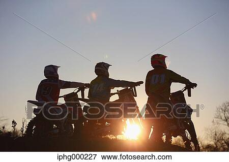 Motocross bikers on dirt track View Large Photo Image Stock Photo - Motocross bikers on dirt track. Fotosearch