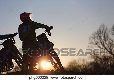 Motocross bikers on dirt track View Large Photo Image Stock Photo - Motocross bikers on dirt track. Fotosearch