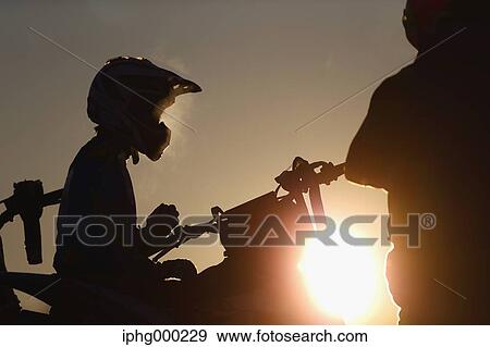 Motocross bikers on dirt track View Large Photo Image Stock Photo - Motocross bikers on dirt track. Fotosearch